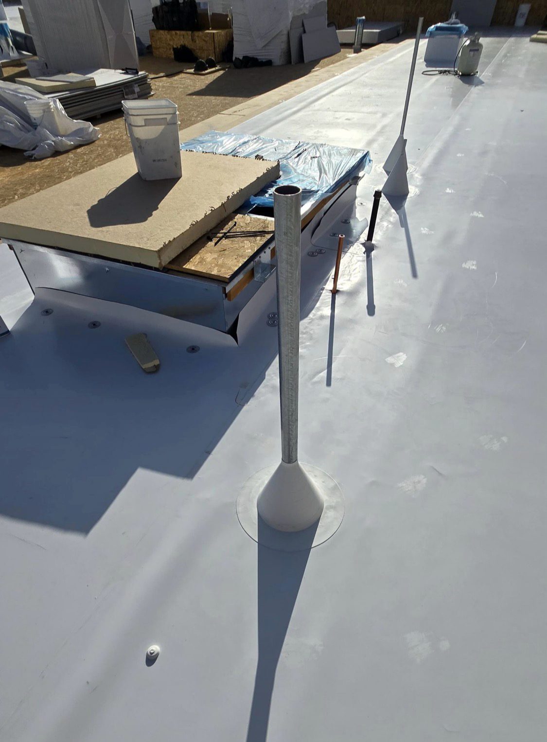 Rooftop equipment supports and pipe flashing detail