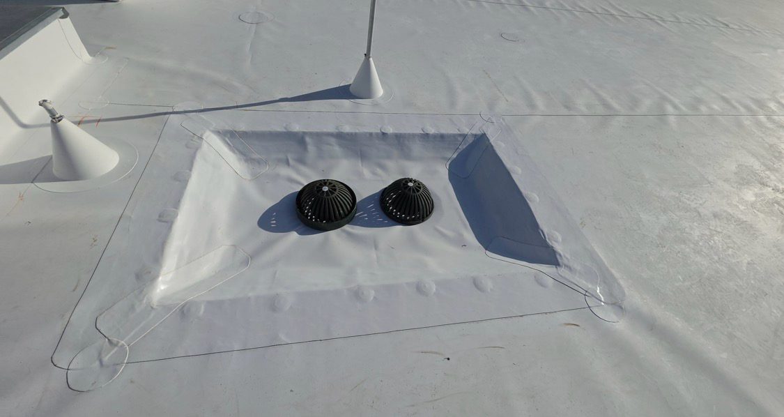 Vent flashing heat-welded into the membrane