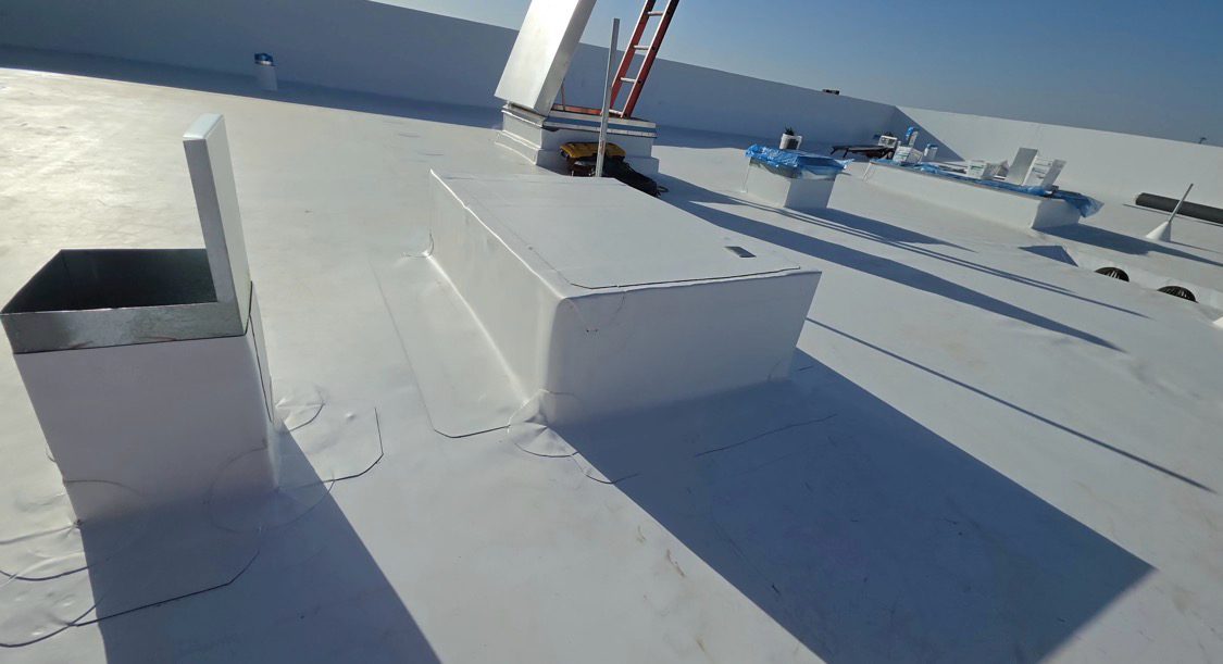 Curb and equipment flashing on a TPO roof