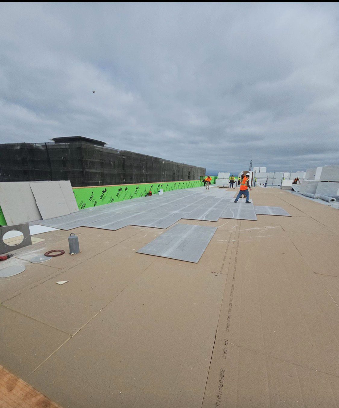 New construction deck with cover board and drain sumps