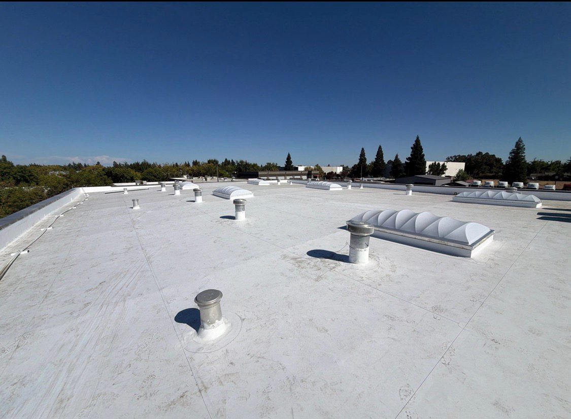 Completed white TPO roof with rooftop units